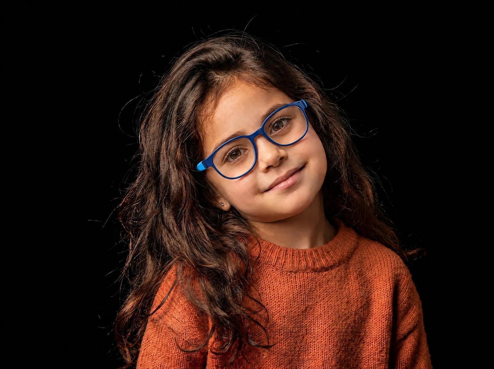 A smiling girl wearing the blue VEGAS ZC1106 kids glasses